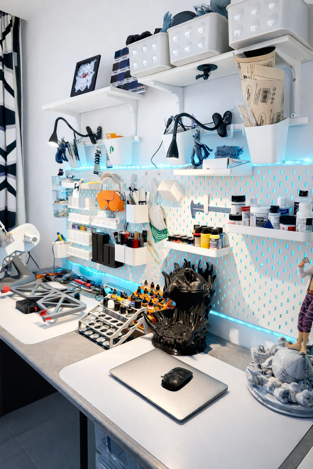 Painting desk with 3D models and supplies